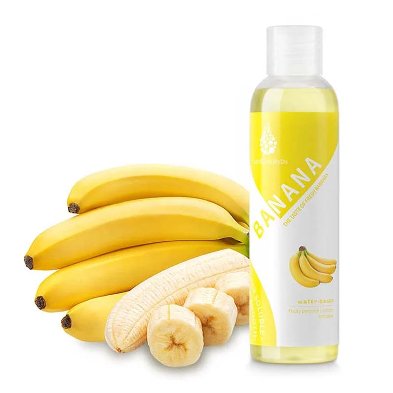 The banana lubricant bottle beside fresh bananas