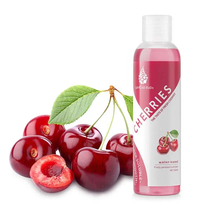 The cherry lubricant bottle beside fresh cherries